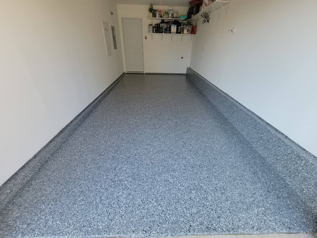 Same garage with full-broadcast flake epoxy floor and gloss topcoat after installation
