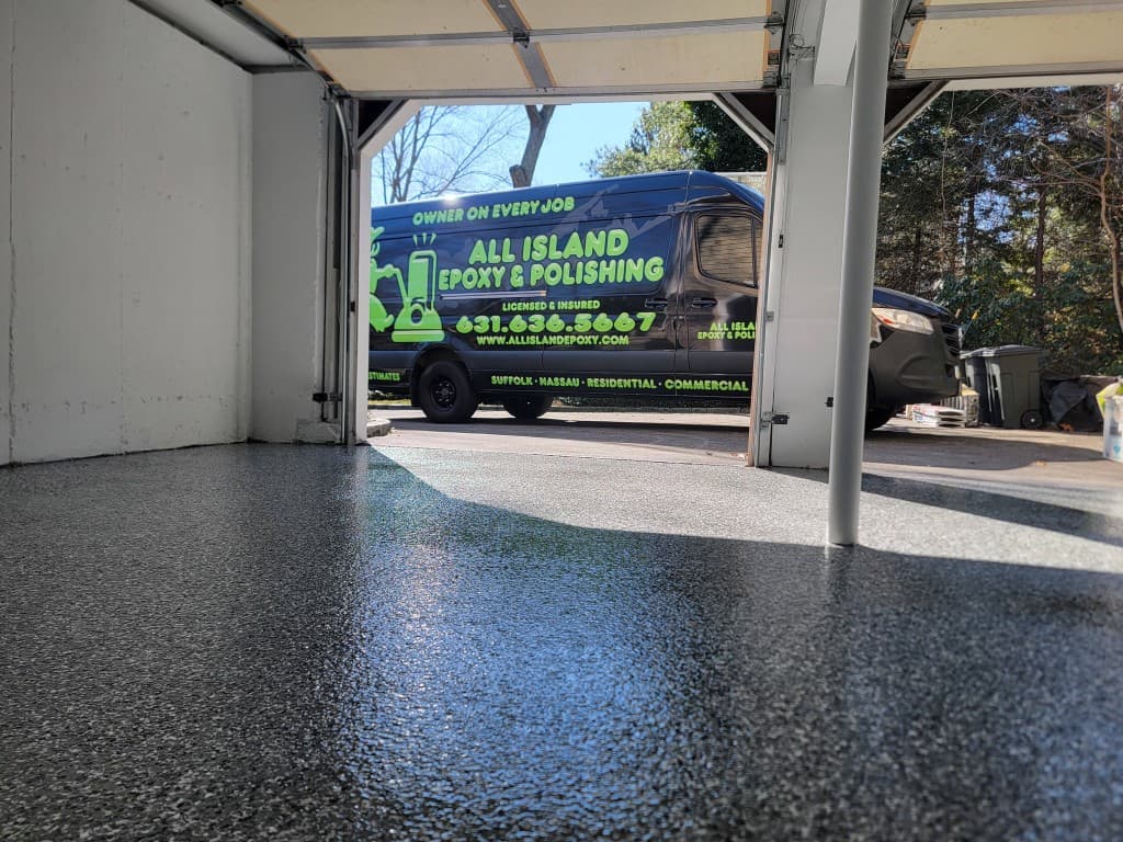 Garage epoxy flake floor with All Island Epoxy company van — Long Island